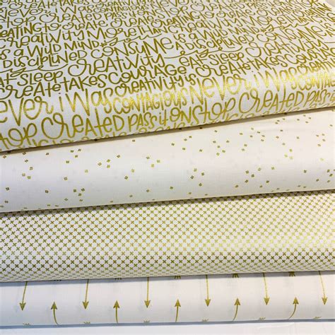 metallic gold and blue fabric|white fabric with gold accents.